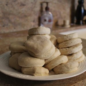 pile of unbaked bread slices on plate