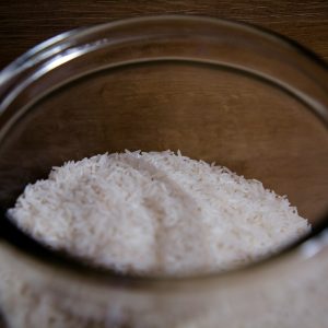 white powder in clear glass container